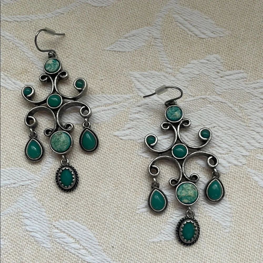 Silver and Green Dangle Earrings with Intricate Design